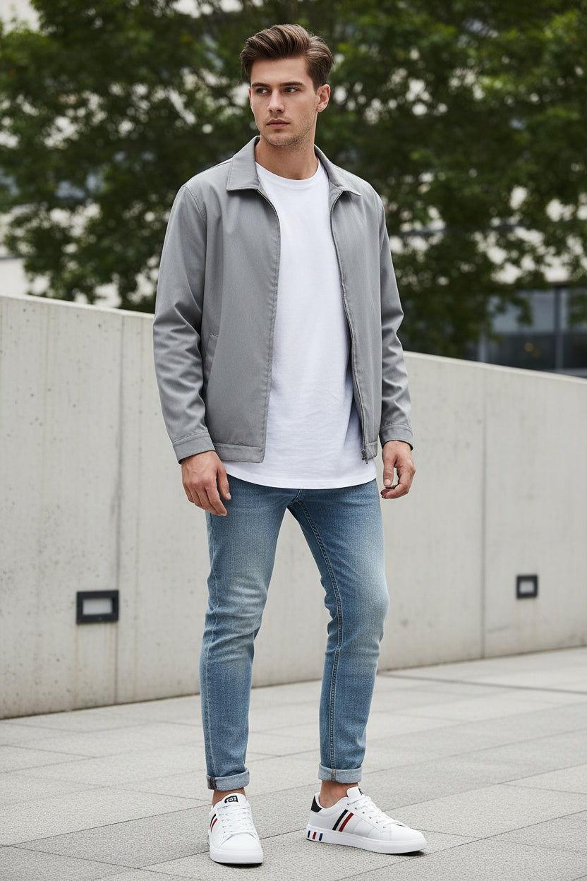 White sneakers with black and red accents on a gray background