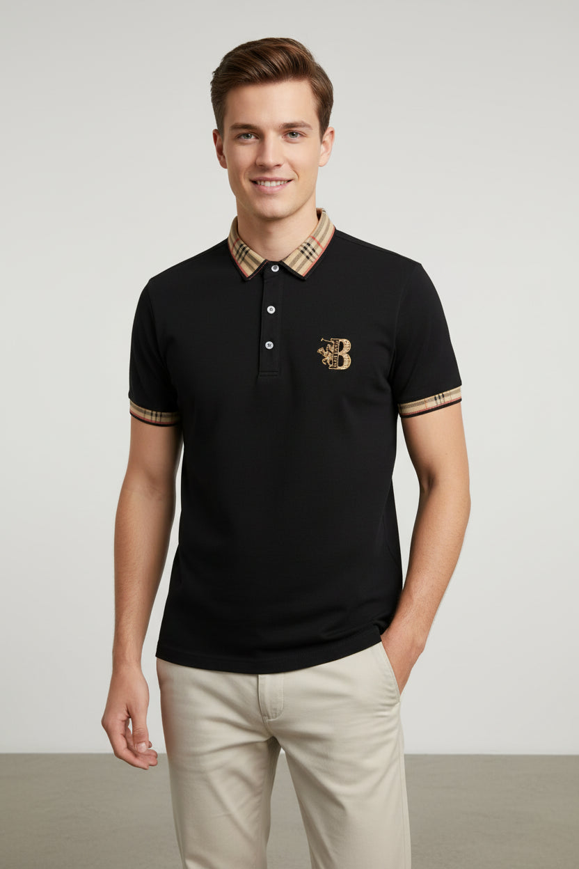 Black polo shirt with plaid collar, watch, and belt on a gray surface