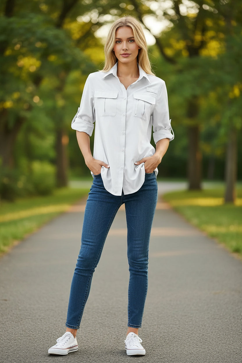 Woman wearing a white button-up shirt with rolled-up sleeves on a white background