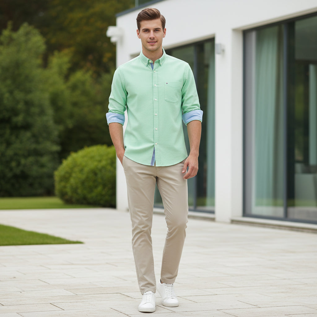 Green shirt with a brand label on a white background