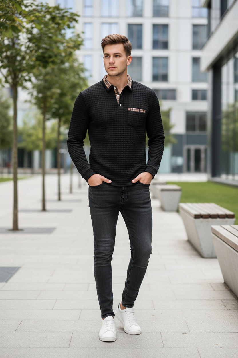 Black textured long-sleeve shirt with plaid collar on a white background