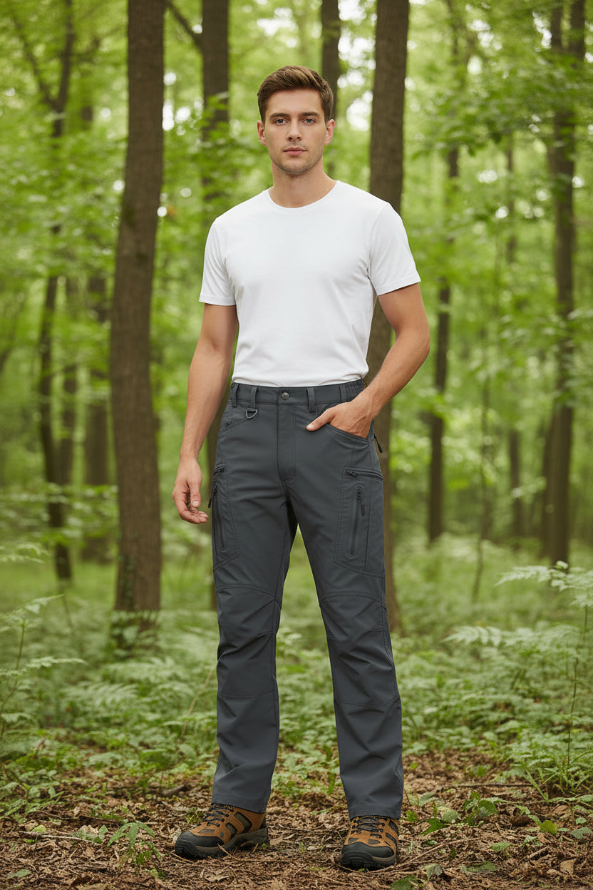 Gray hiking pants with multiple pockets and a brand logo on a white background