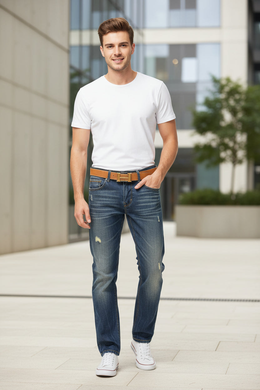 Blue jeans with a brown belt on a white background