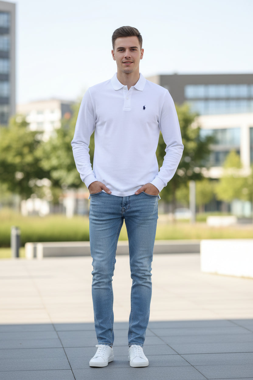 White long-sleeve polo shirt with brand logo on a hanger in a clothing store.