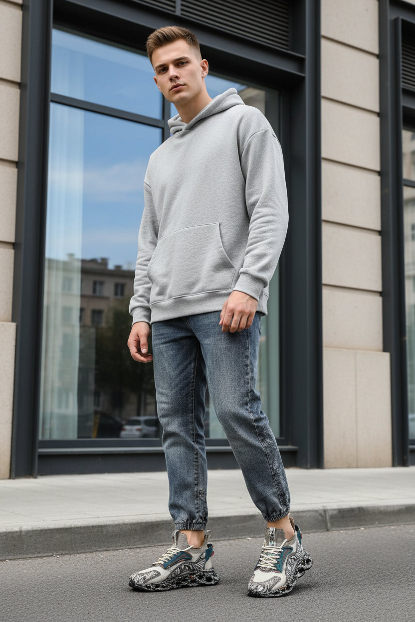 Person wearing futuristic shoes with a unique design on a light gray background