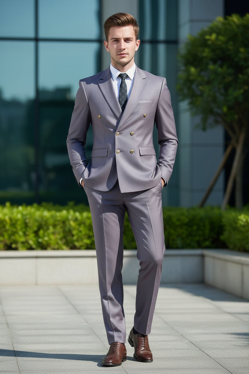 Gray suit with gold buttons worn by a person against a blurred background