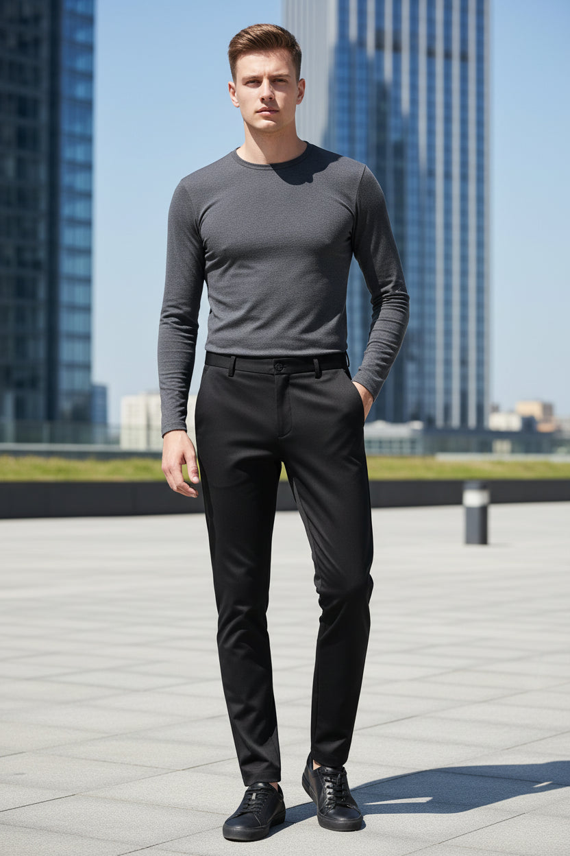 Black pants with a belt on a gray background