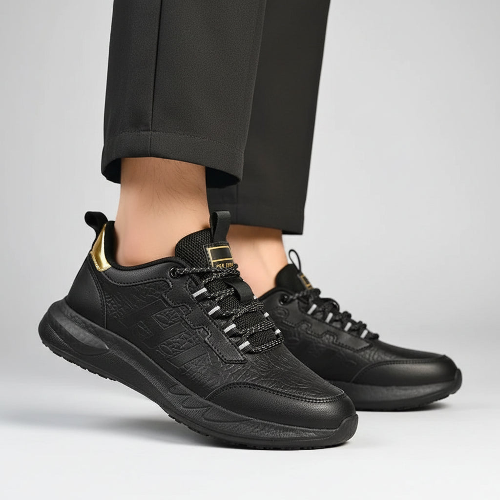 Black sneakers worn on a wooden floor with blurred background