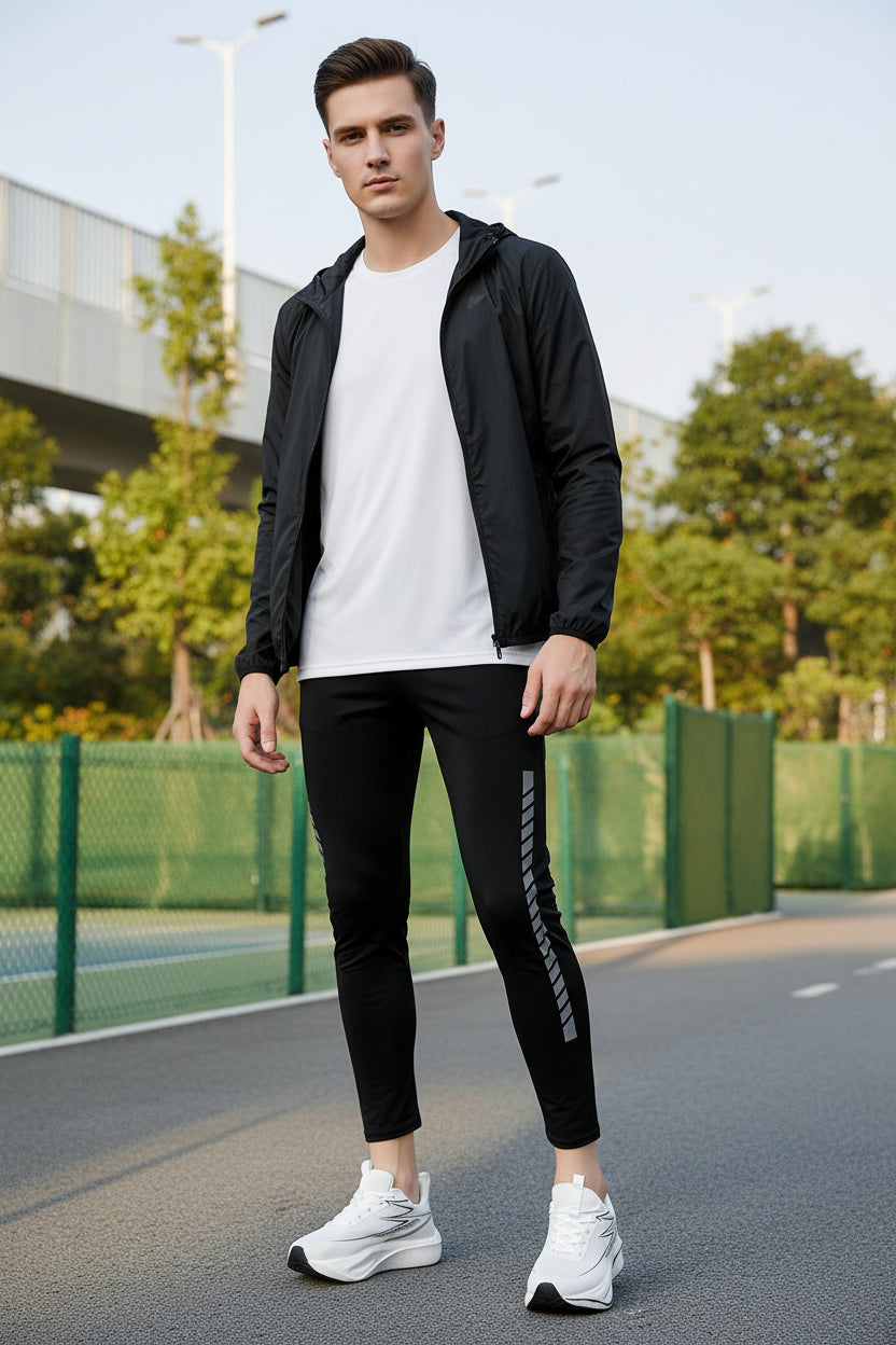 White running shoes with black soles on a blurred outdoor background