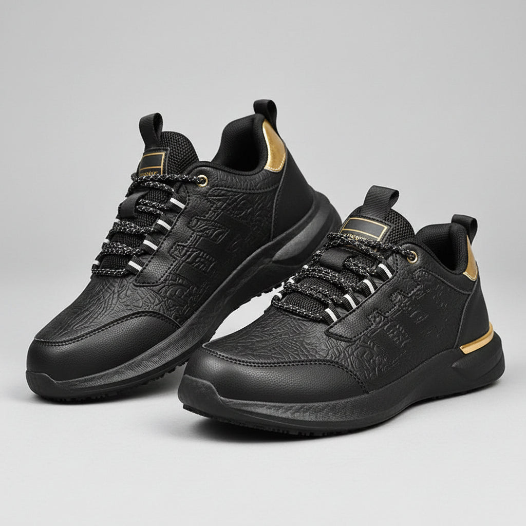 Black and gray sneakers worn on a wooden floor with blurred background