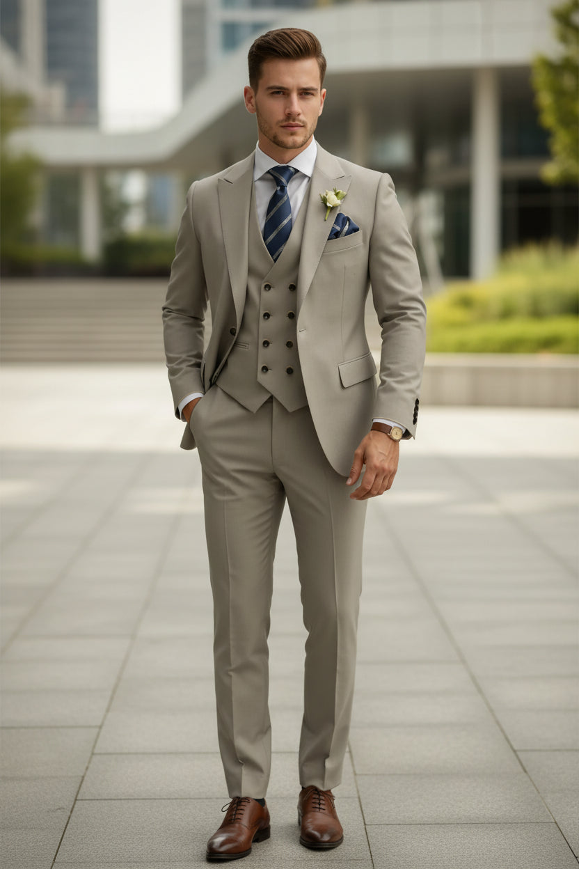 Beige suit with striped tie and pocket square on a white background