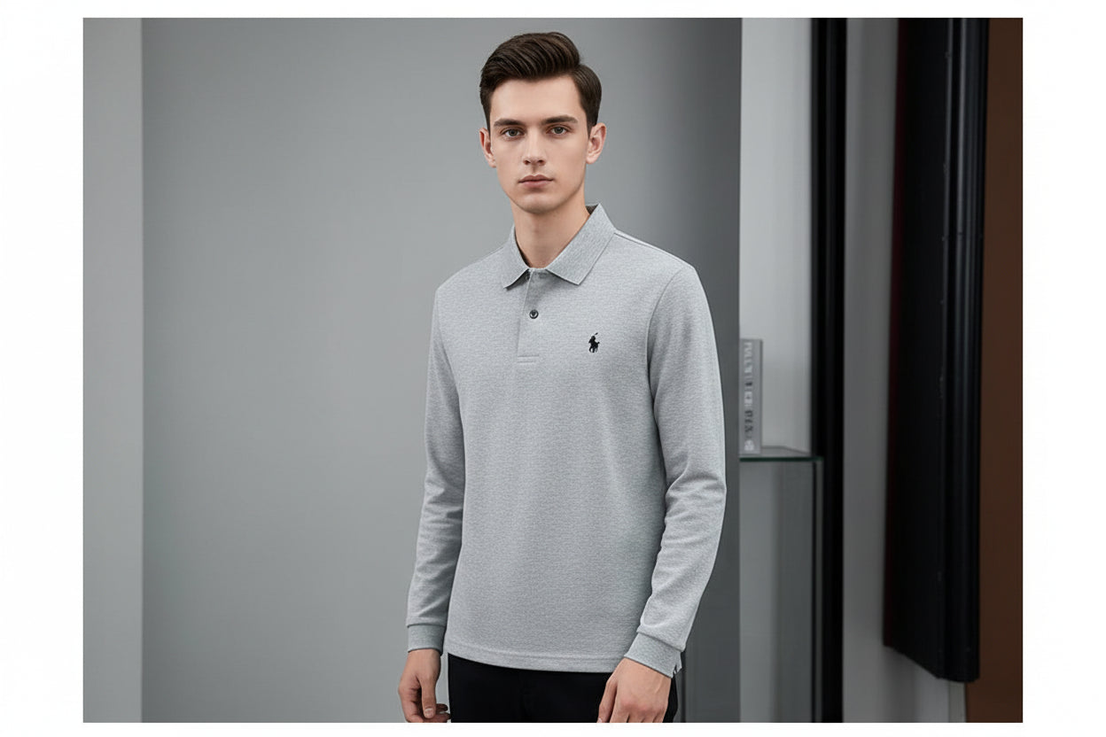 Gray polo shirt with a brand logo held by a hand, hanging on a black hanger.