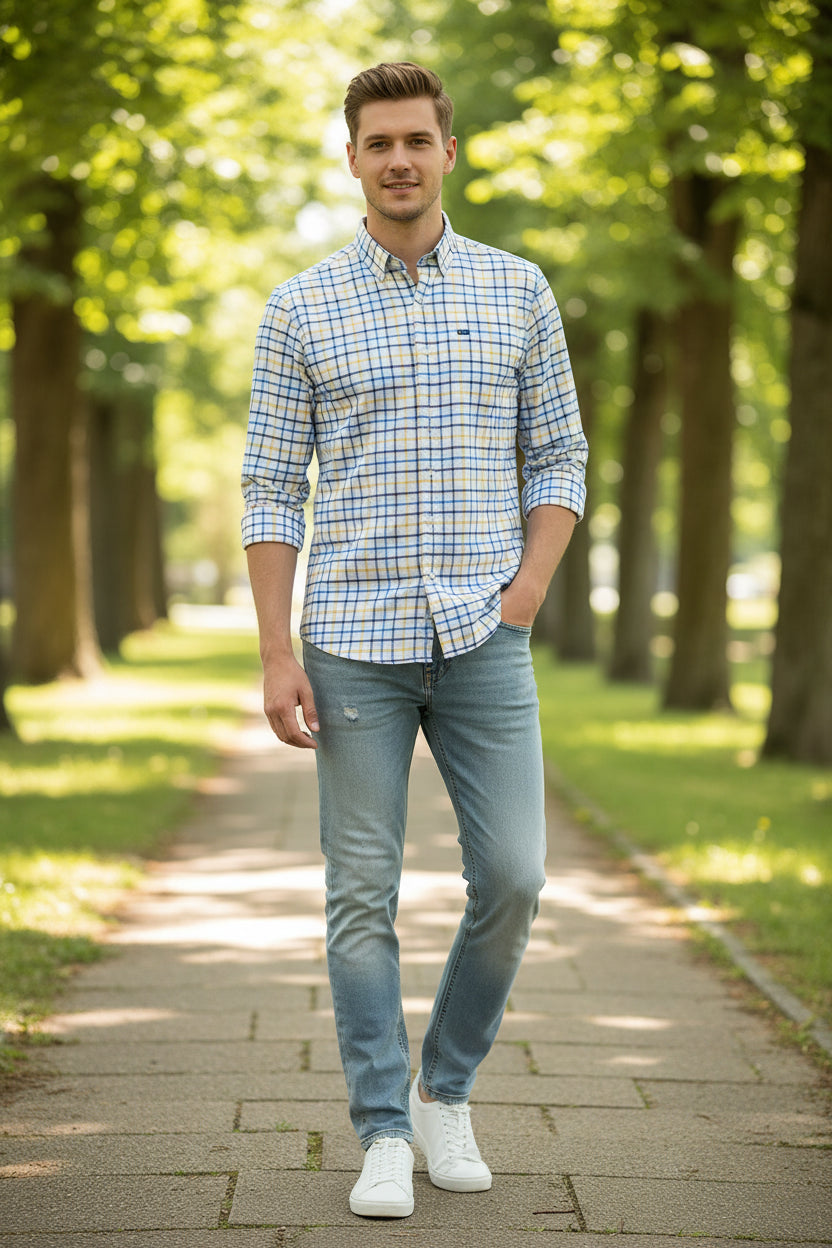 Folded checkered shirt with brand logo on a light gray background