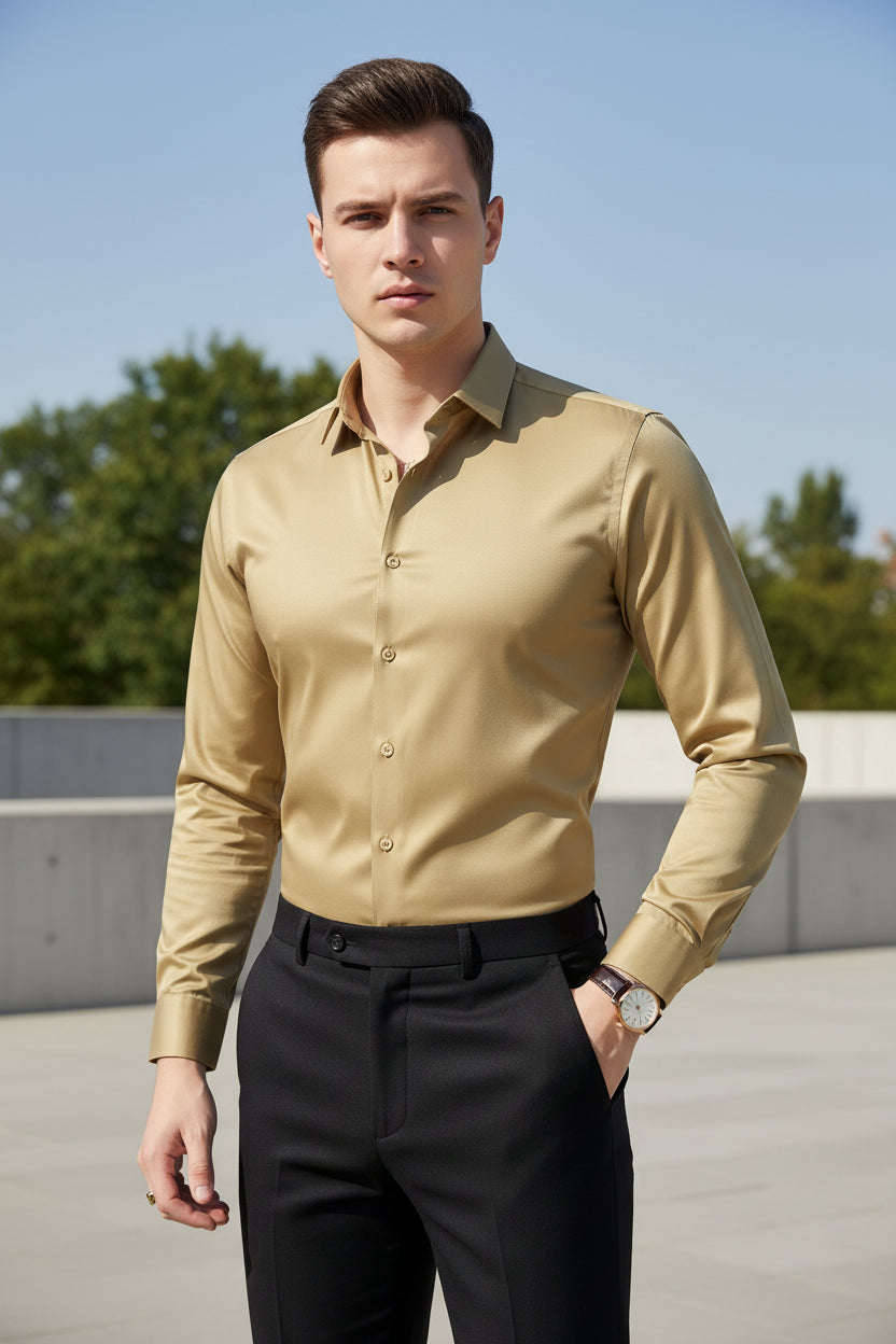 Man wearing a gold dress shirt in an indoor setting
