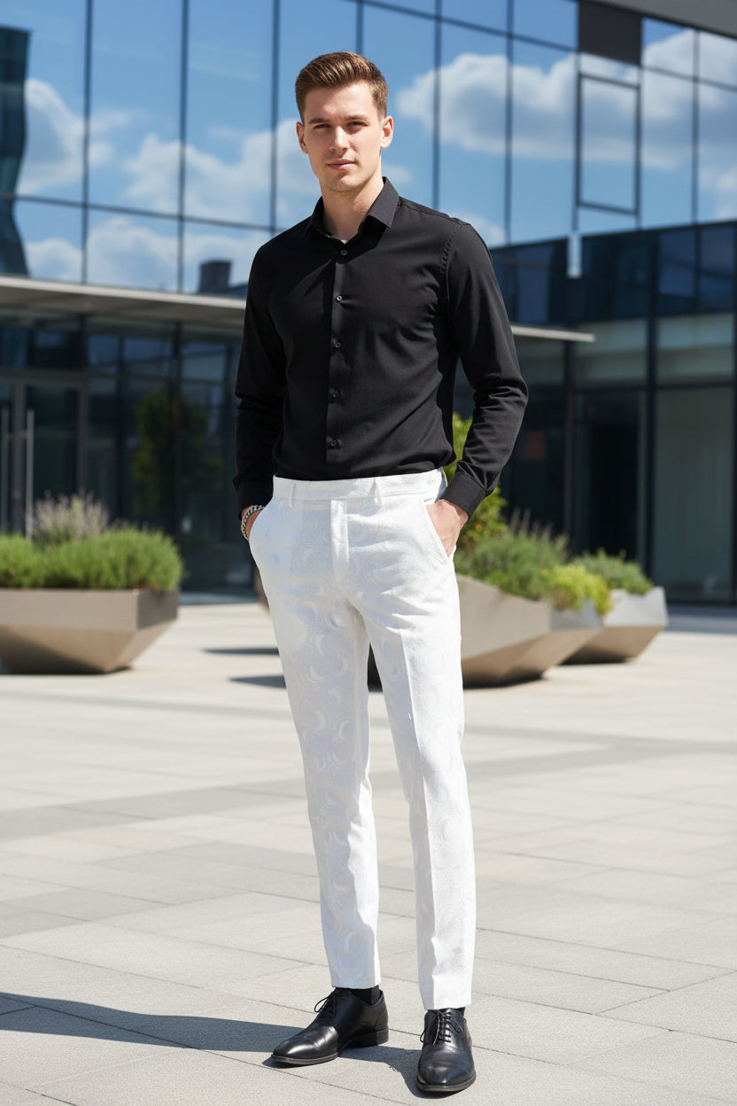 Person wearing white pants and black shoes in an indoor setting