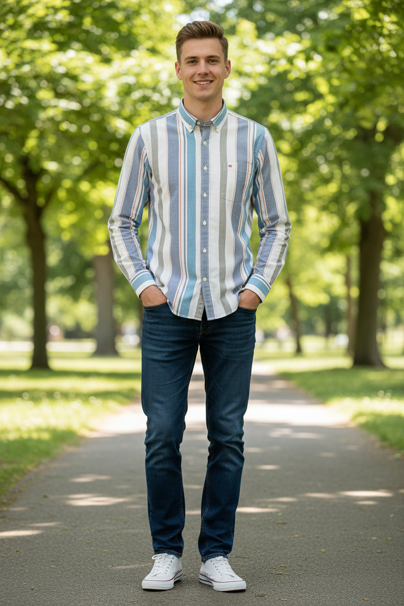 Folded striped shirt with a visible brand logo on a white background
