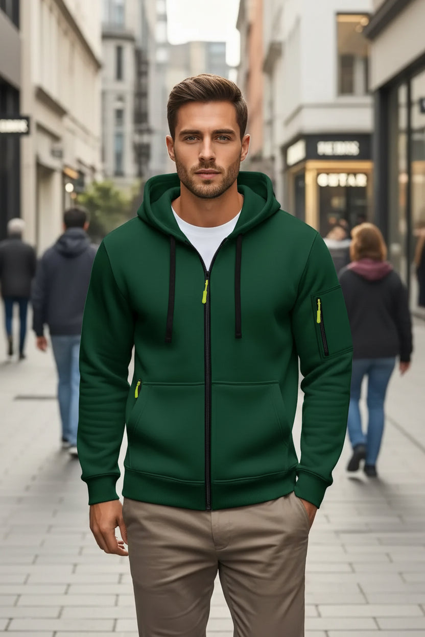 Man wearing a green hoodie with yellow zippers in an urban setting