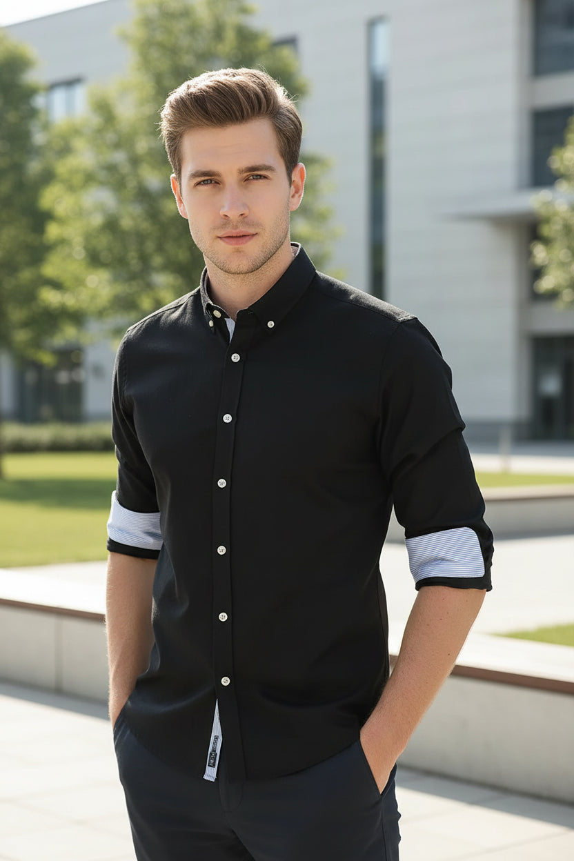 Black dress shirt with light blue collar on a white background