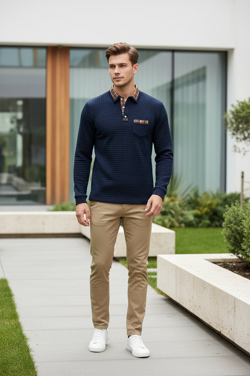 Navy blue textured sweater with plaid collar and pocket on a white background