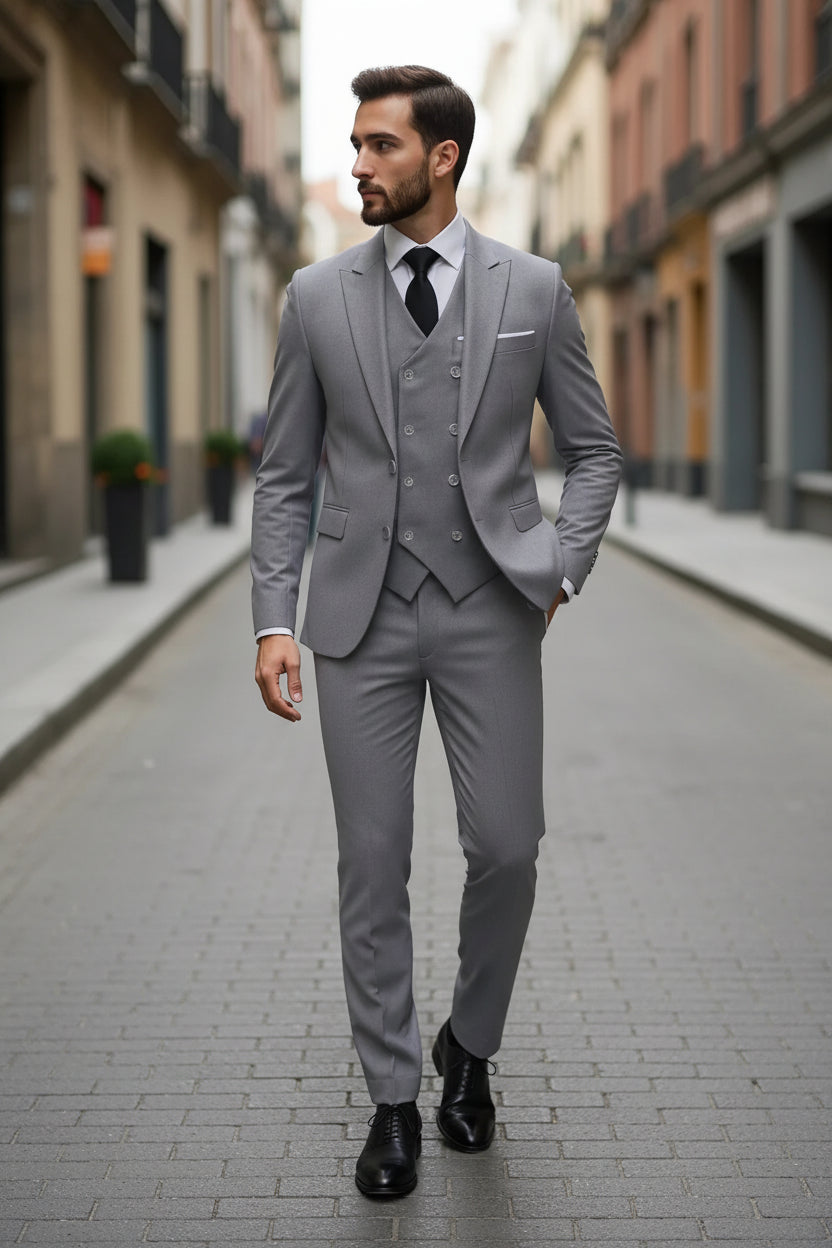Man wearing a gray suit with a tie on a city street