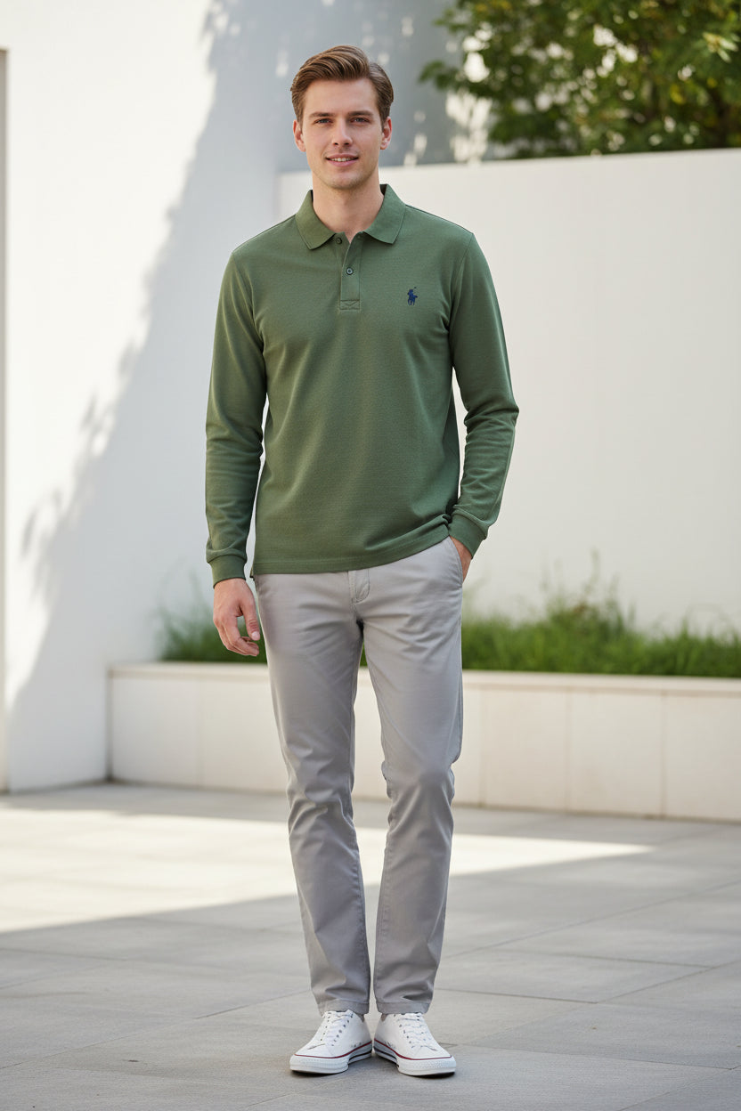 Green polo shirt with Ralph Lauren logo held by a hand against a blurred background