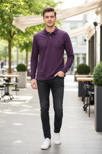 Purple polo shirt held by a hand with a visible brand logo, on a hanger against a blurred background.
