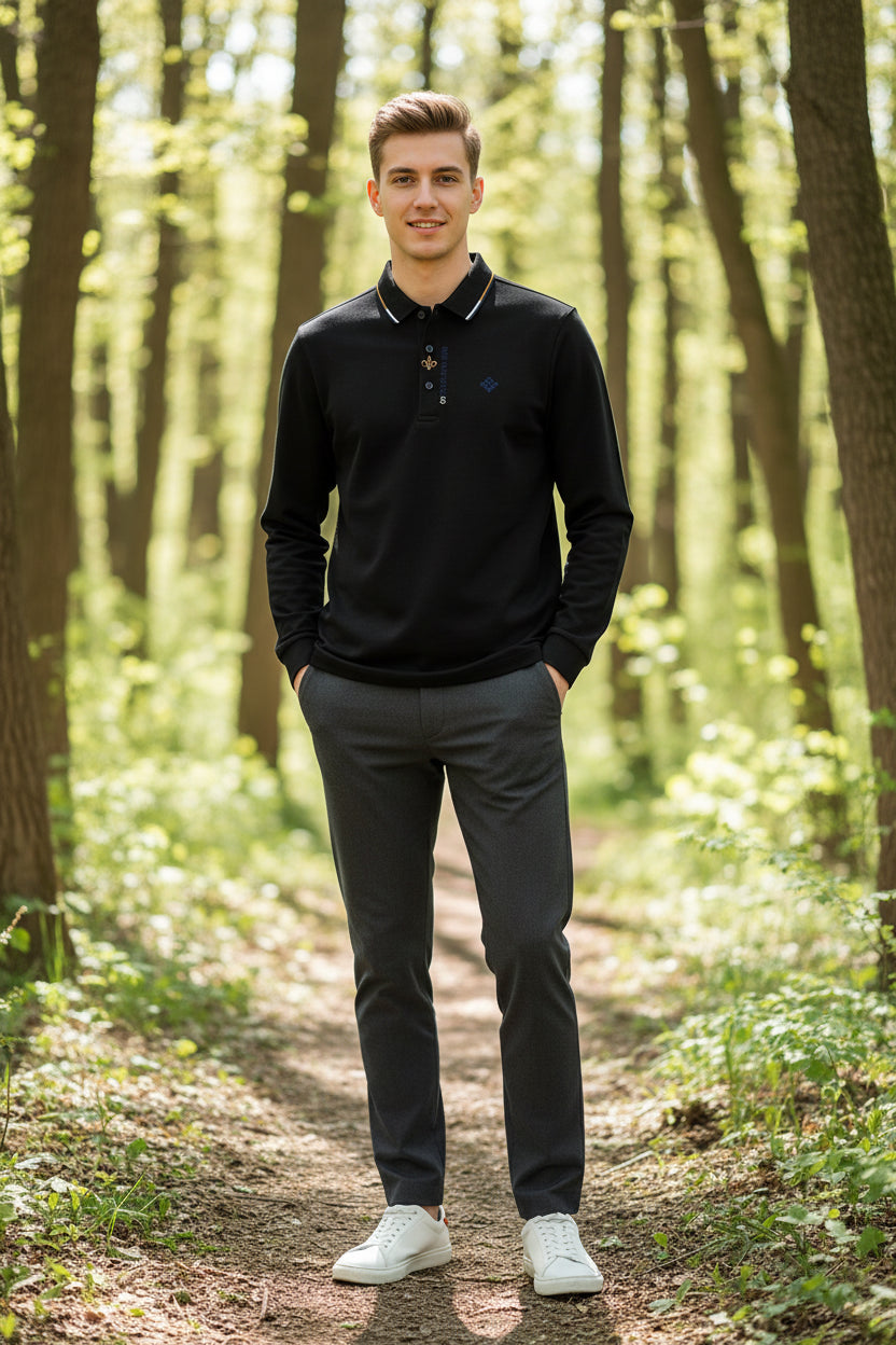 Black long-sleeve polo shirt on a hanger against a gray background