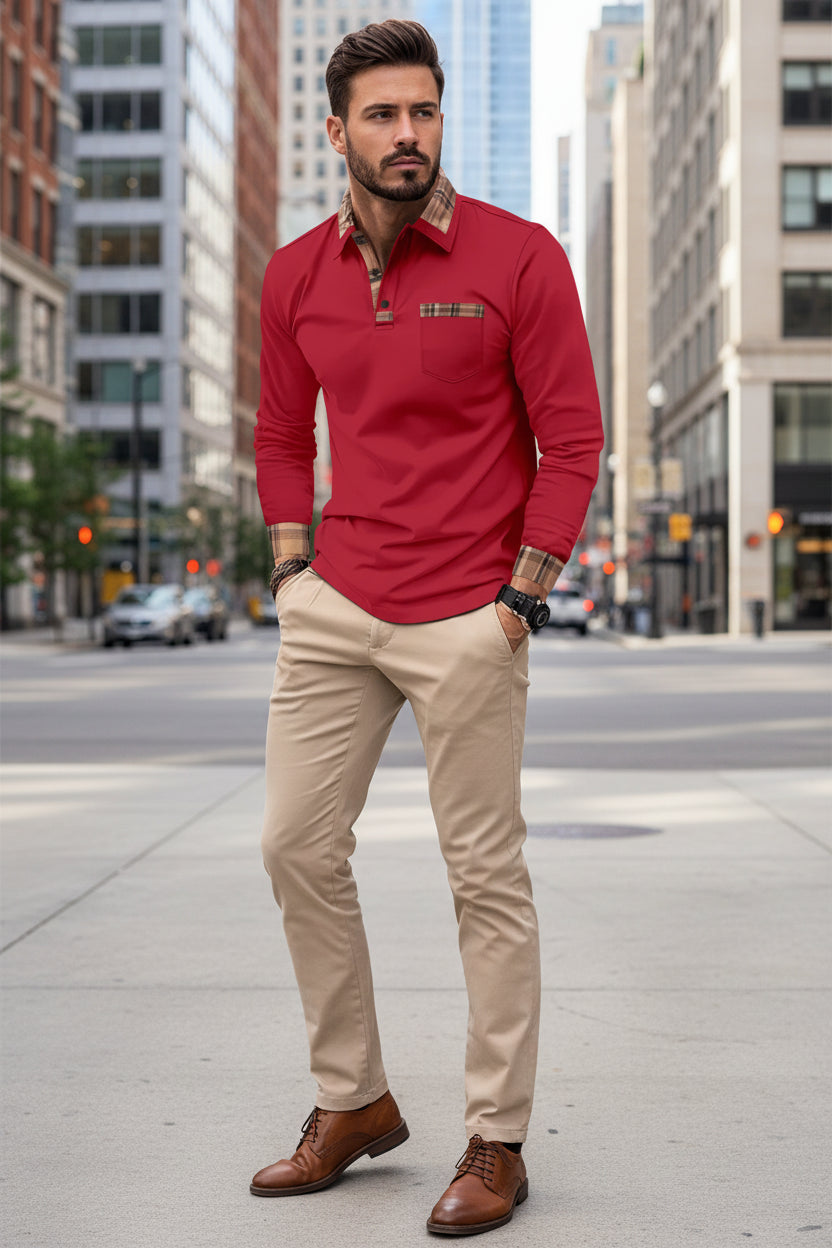Man wearing a red long-sleeve shirt with plaid accents on a city street.