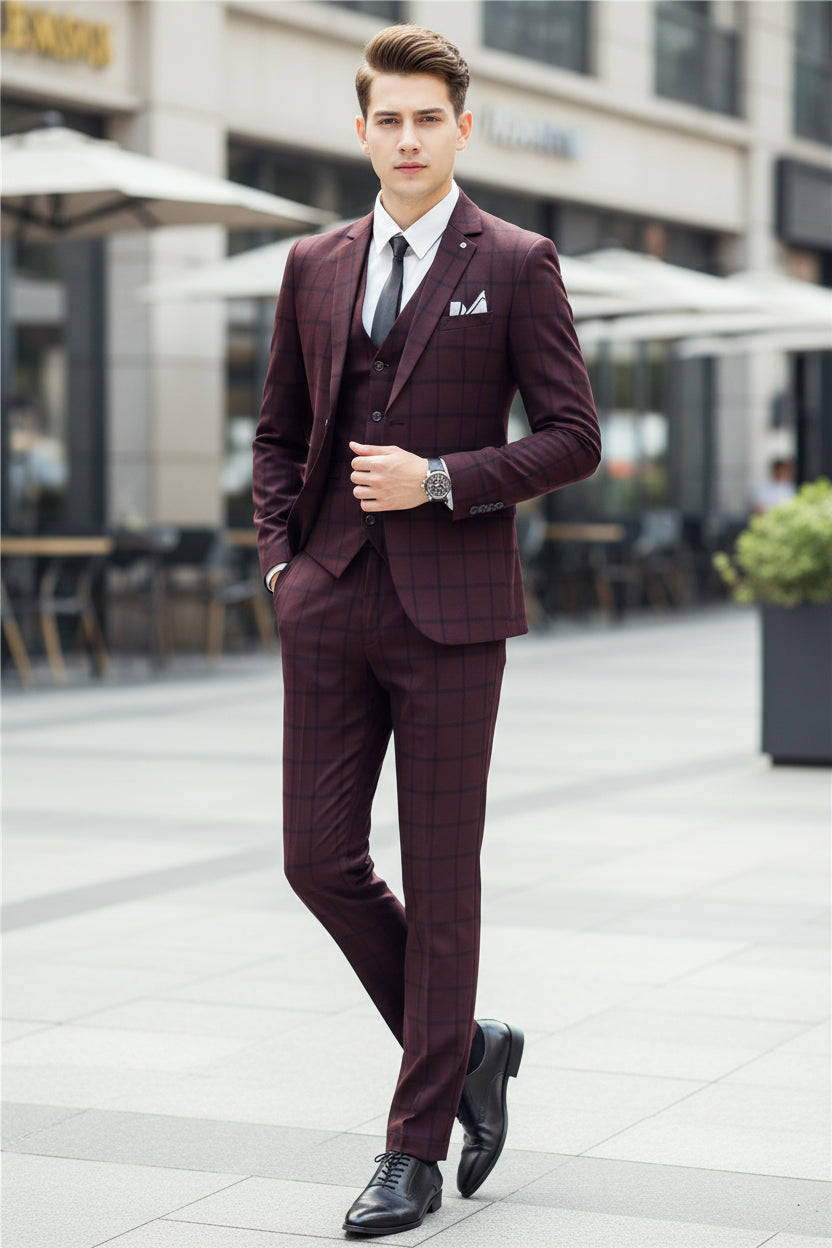 Man wearing a maroon checkered suit in a cafe setting
