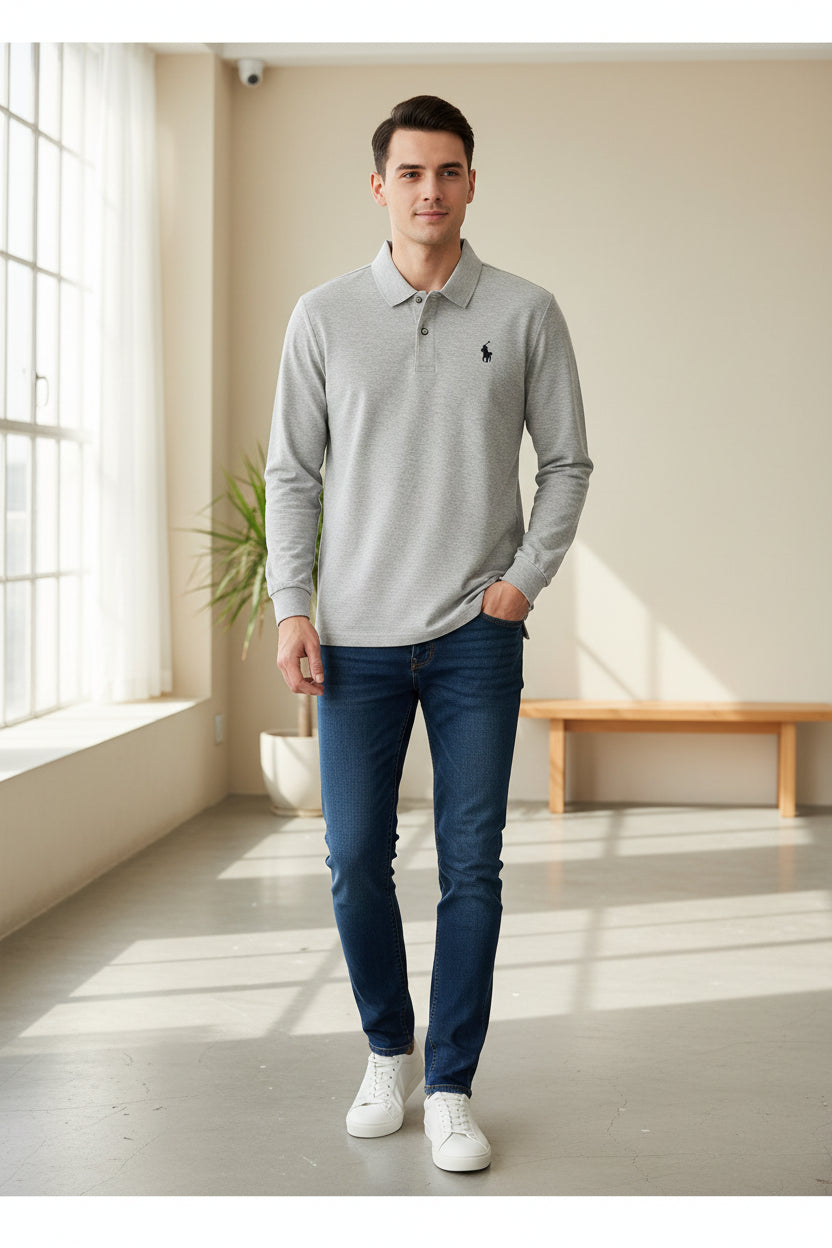 Gray long-sleeve polo shirt with Ralph Lauren logo on a rack with other shirts.