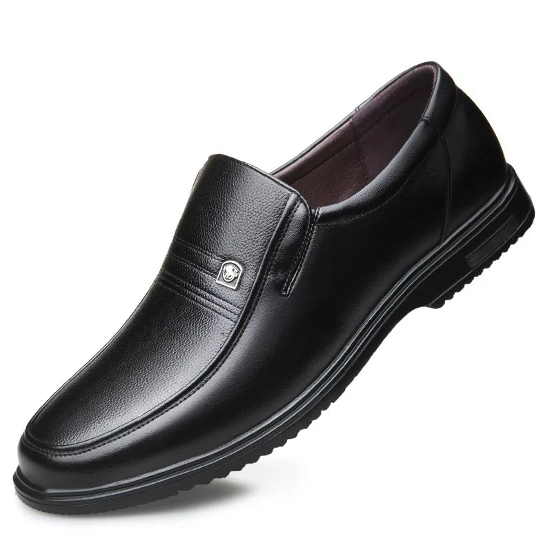 Black leather dress shoe on a white background