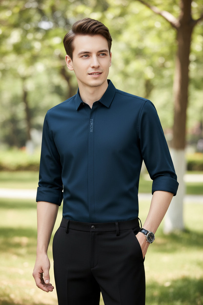 Navy blue dress shirt with rolled-up sleeves on a gray background