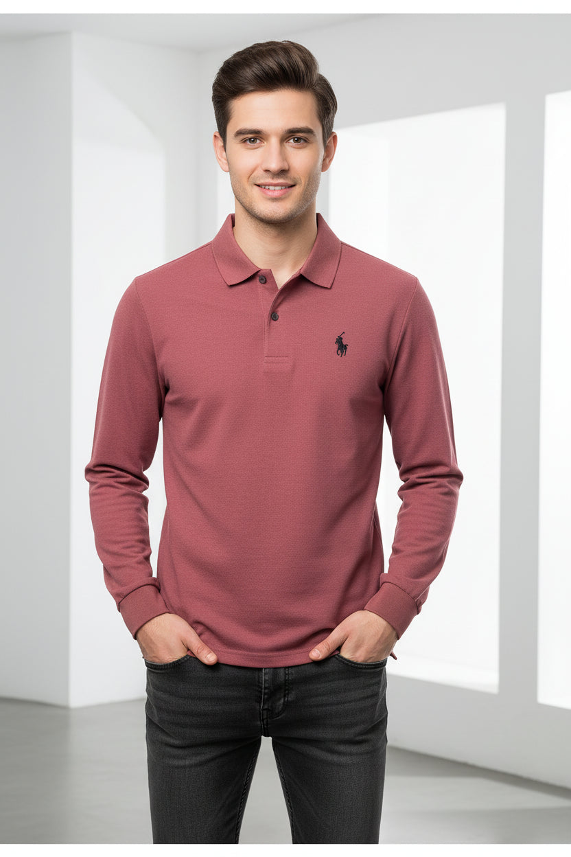 Pink polo shirt with a brand logo on a hanger in a clothing store.
