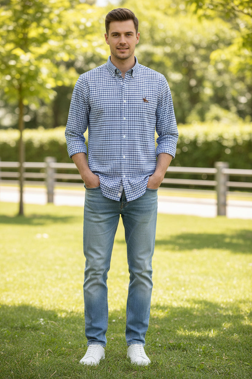 Folded blue and white checkered shirt with a logo on a light gray background