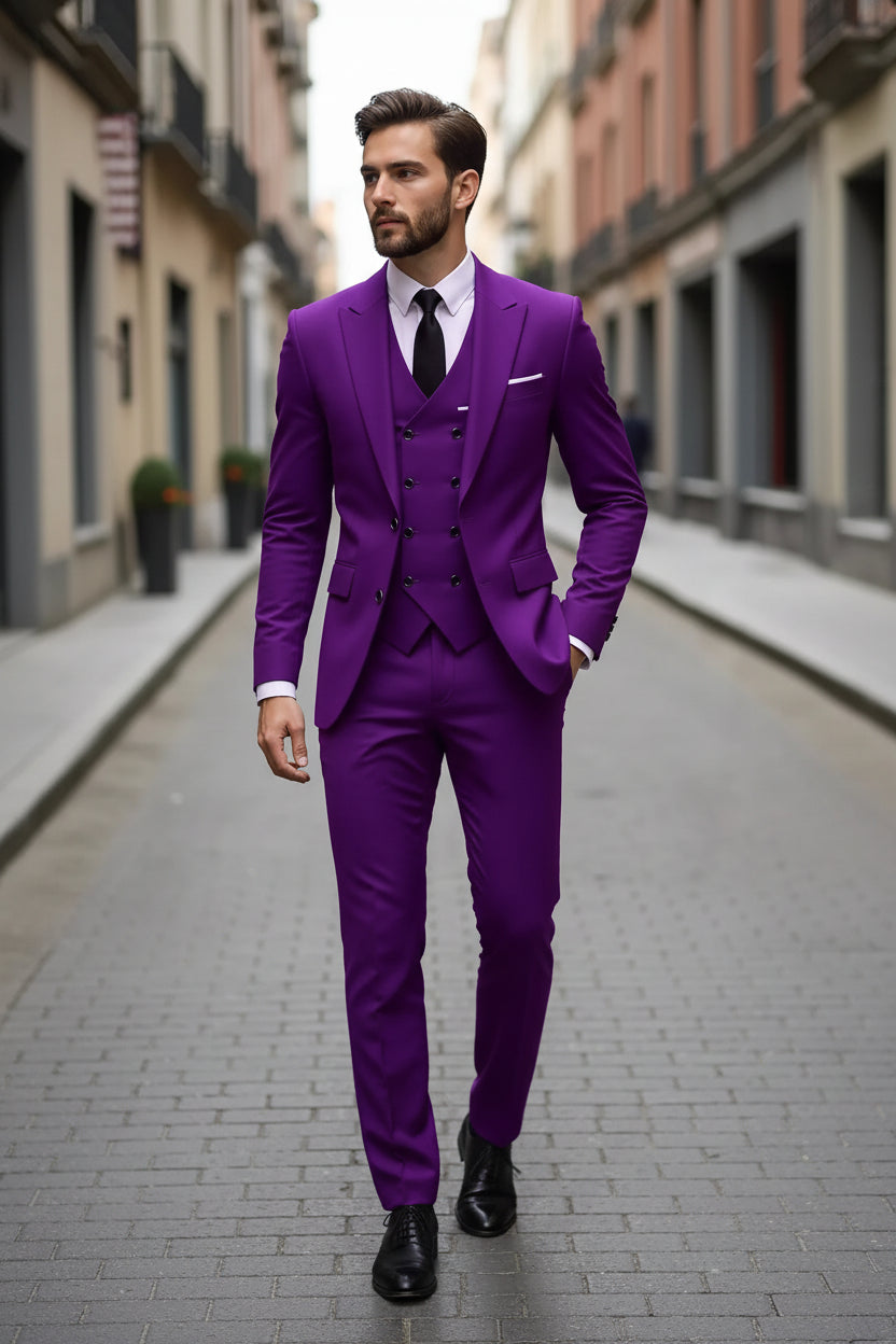 Man wearing a purple suit with a black tie on a city street.