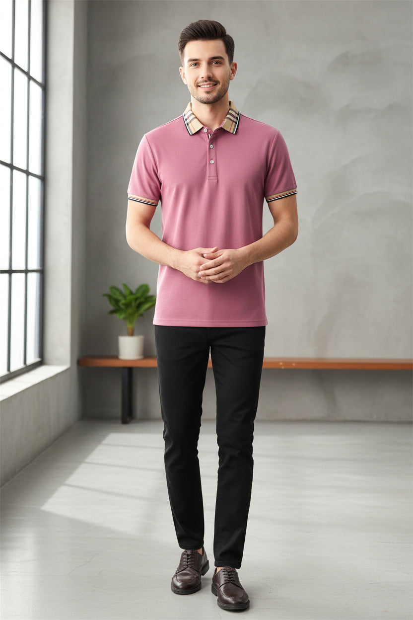 Pink polo shirt with plaid collar held by a hand, brand label visible