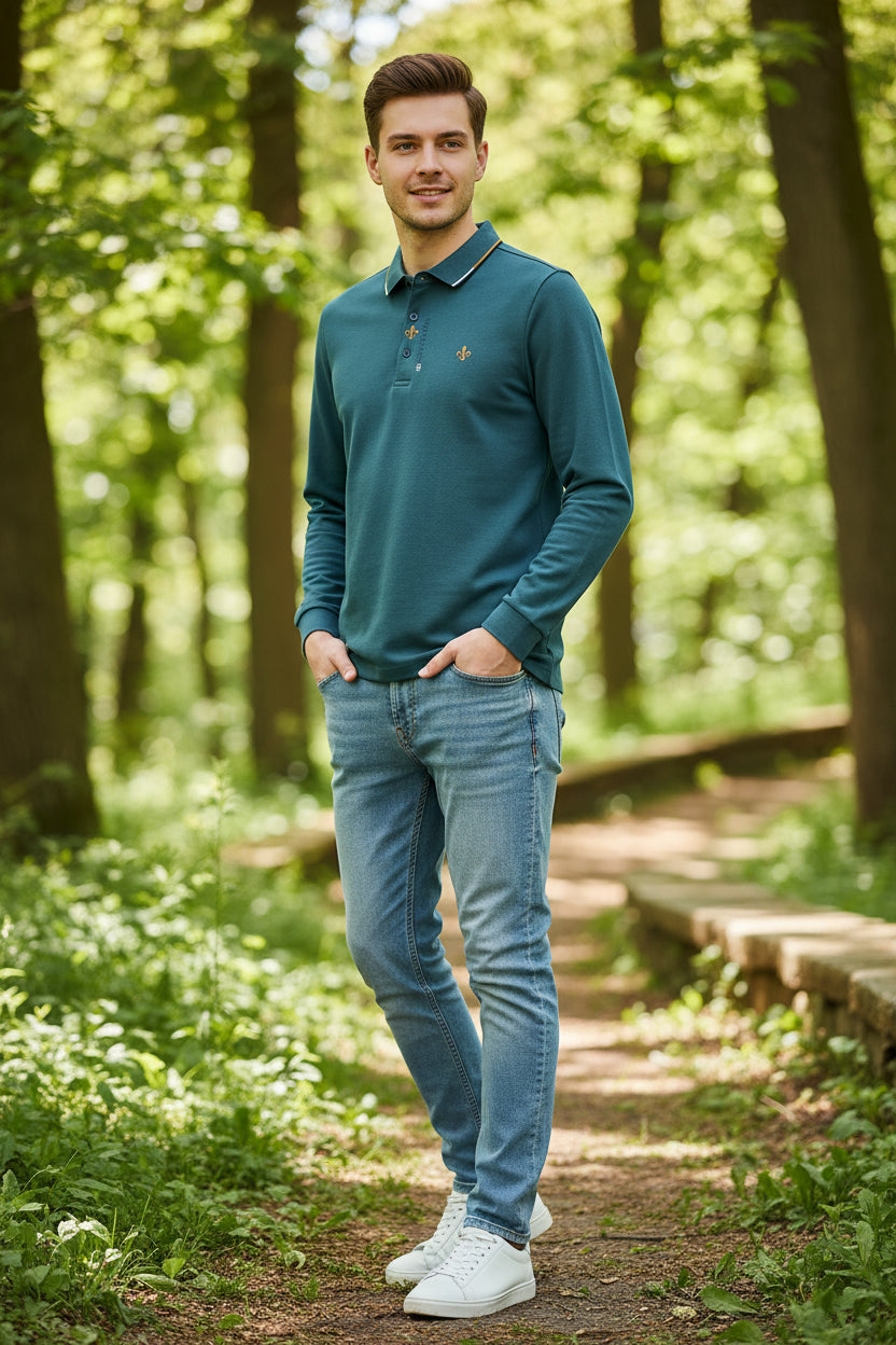 Teal long-sleeve polo shirt on a hanger against a gray background
