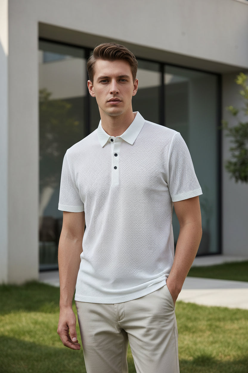 White textured polo shirt on a hanger against a white background
