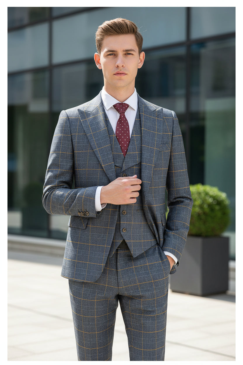Gray checkered suit on a mannequin with a red tie against a beige curtain background