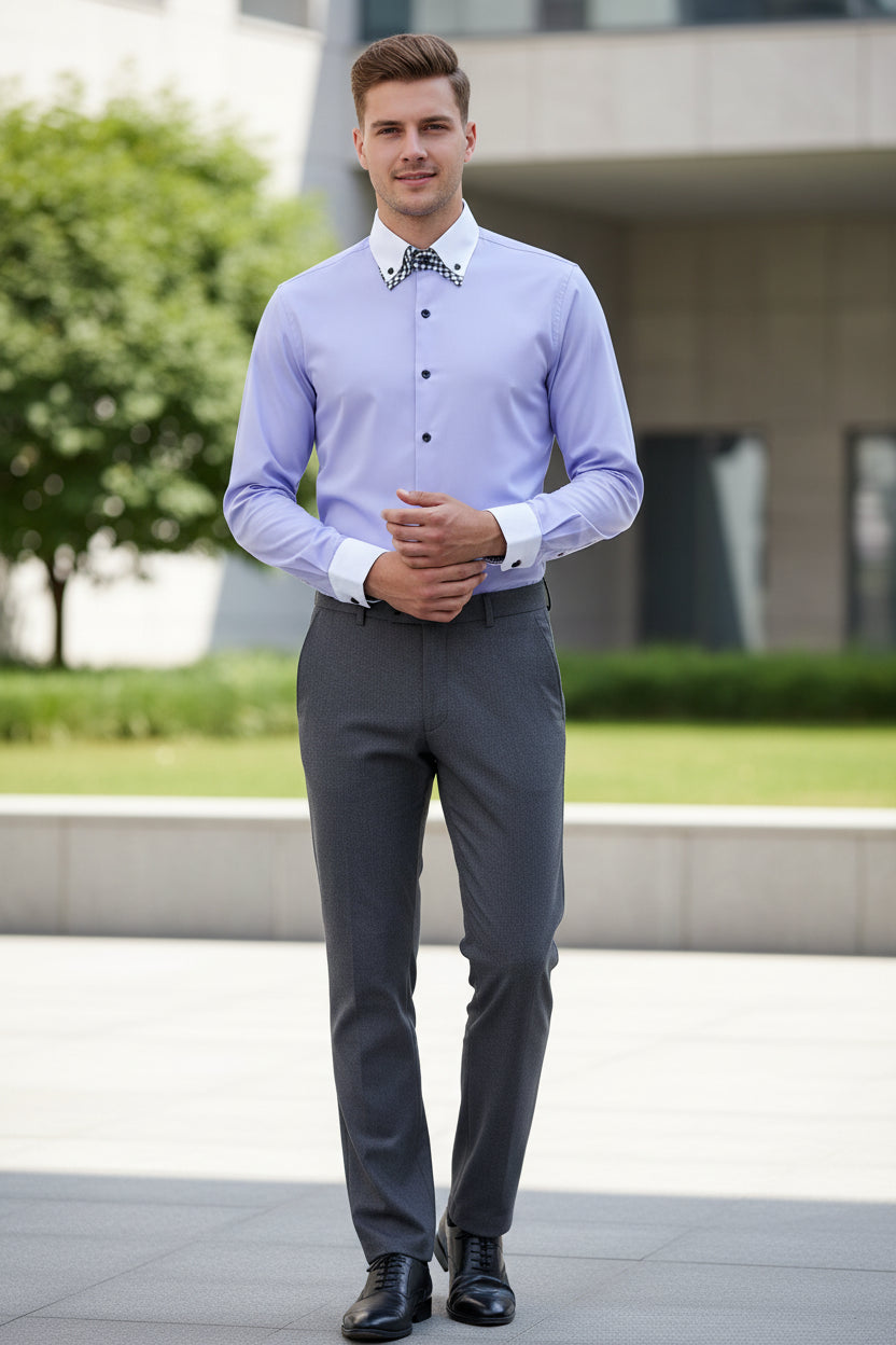 Folded light purple dress shirt with checkered inside collar on a gray background