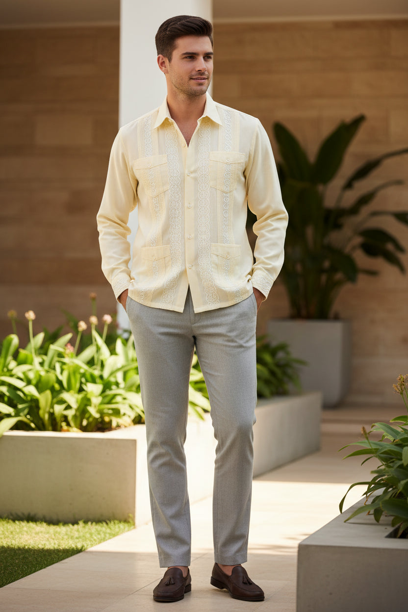 Light yellow long-sleeve shirt with intricate patterns young man wearing it outside.