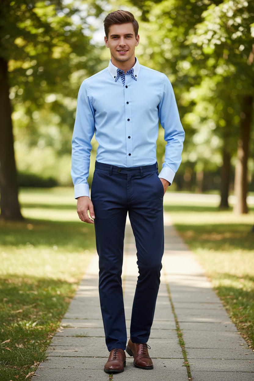 Light blue dress shirt with checkered inner lining on a gray background