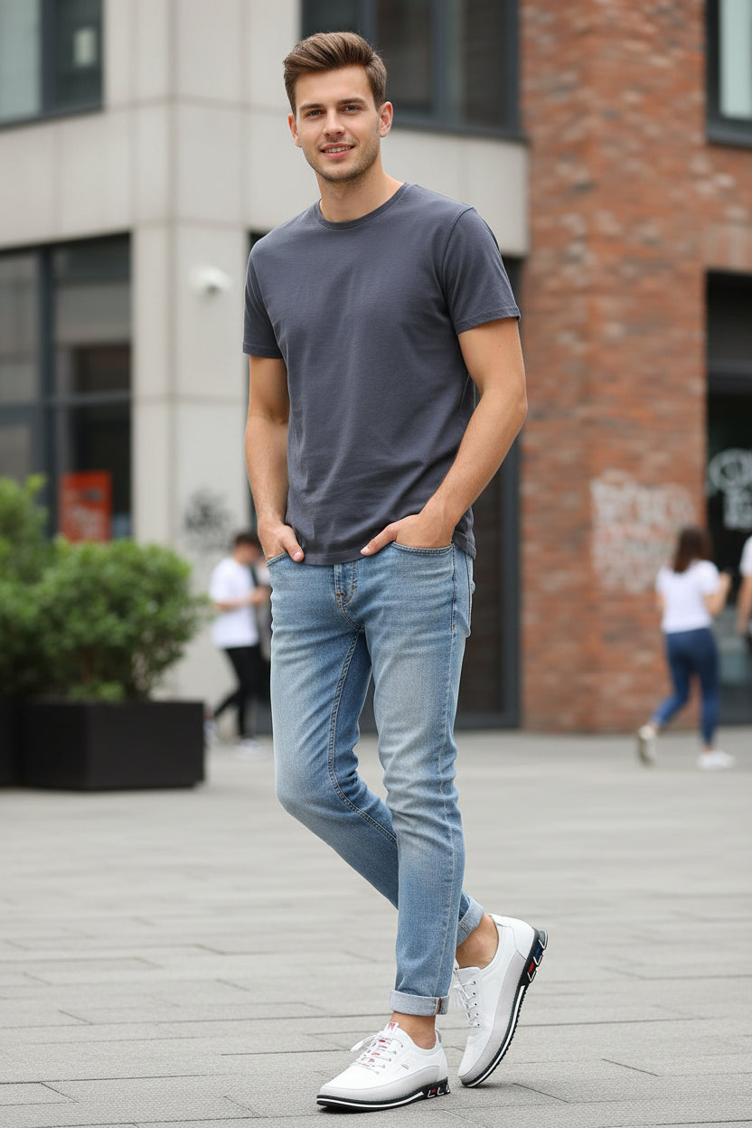 White sneaker with black sole on a gray background