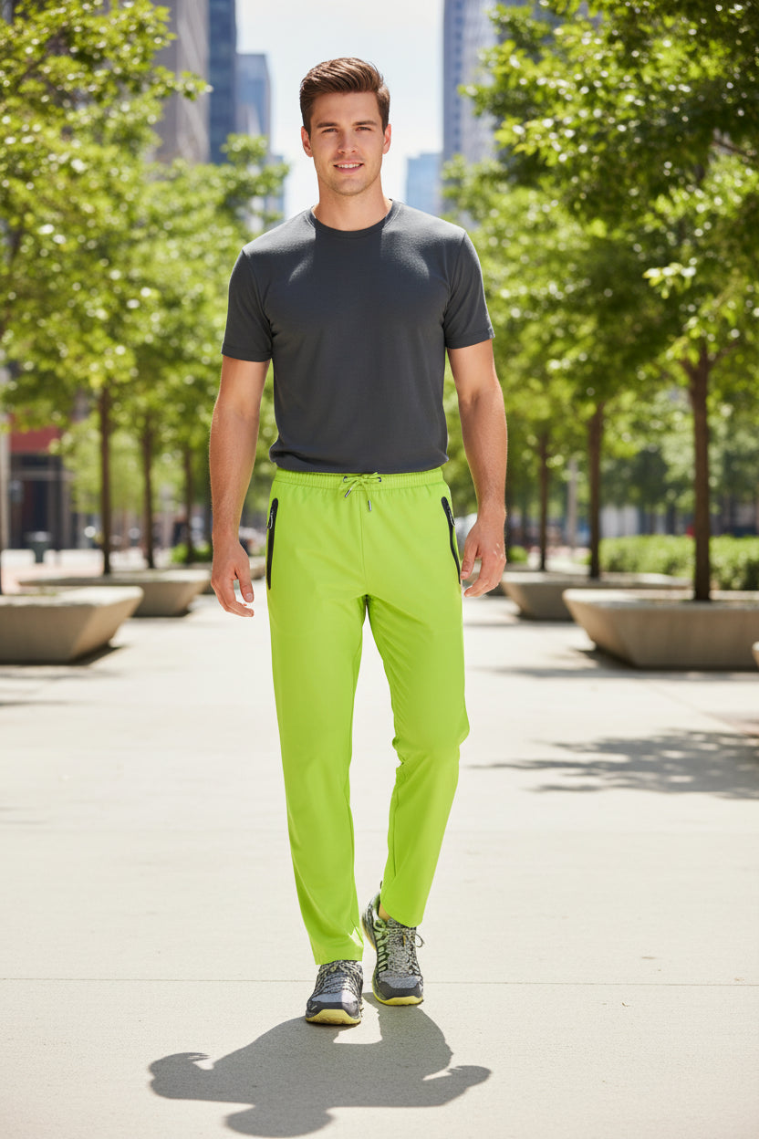 Bright green pants with a black zipper on a white background