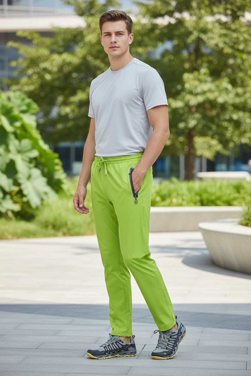 Bright green pants with a black zipper on a white background