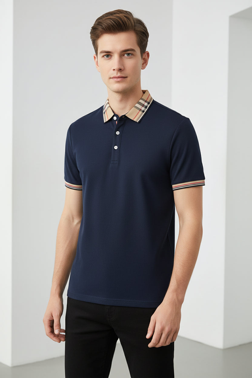 Navy blue polo shirt with plaid collar on a stand in a clothing store.