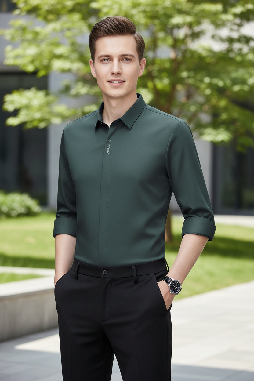 Green dress shirt with rolled-up sleeves on a gray background