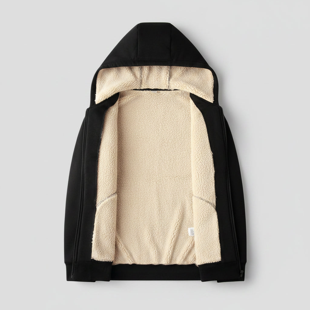 Black jacket with beige fleece lining on a beige textured background