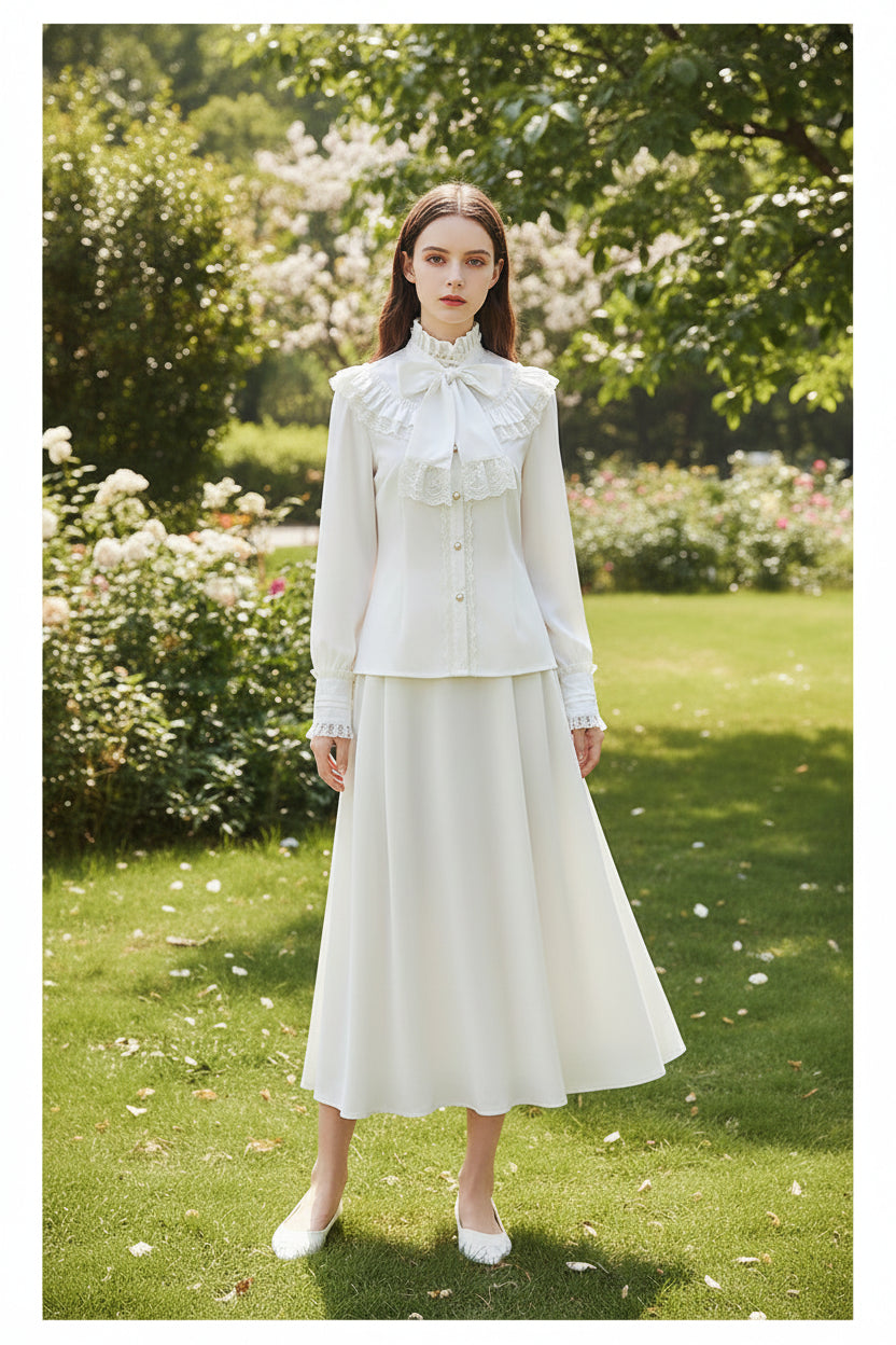 White blouse with lace details and a bow on a white background