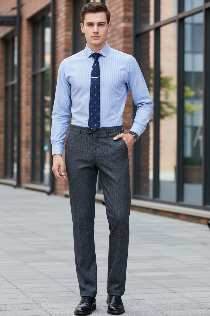 Gray dress pants worn by a person on a white background